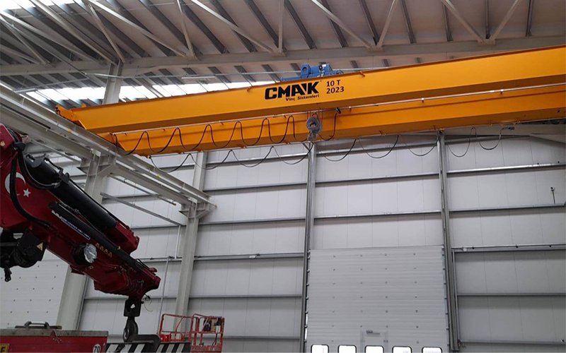 cmak-yellow-overhead-crane-inside-industrial-warehouse.png cmak yellow overhead crane inside industrial warehouse